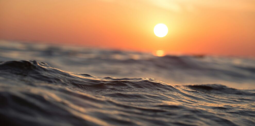 Viva miami Captivating ocean waves with a vibrant sunset sky, perfect for tranquil moments.